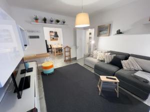 a living room with a couch and a table at Da Carlotta in Bassano del Grappa