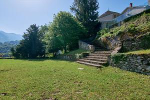 a set of stairs on a hill with a house at chateau d'escart in Arvillard