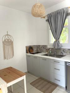 A kitchen or kitchenette at Seaside Studios Arkasa Karpathos