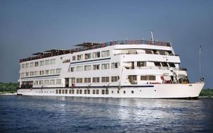 a large white cruise ship on the water at Sofia Nile Cruise Luxor To Aswan in Luxor
