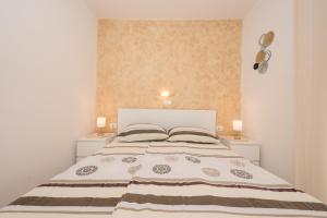 Postel nebo postele na pokoji v ubytování Apartmani Marica Beg