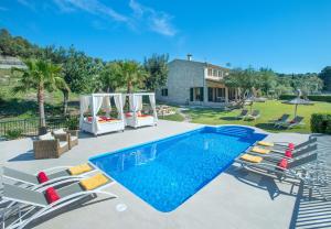 The swimming pool at or close to Owl Booking Villa Siquier - Luxury Retreat with Mountain Views
