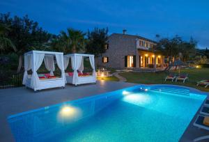 The swimming pool at or close to Owl Booking Villa Siquier - Luxury Retreat with Mountain Views