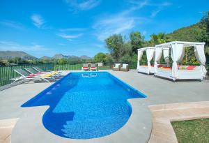 The swimming pool at or close to Owl Booking Villa Siquier - Luxury Retreat with Mountain Views