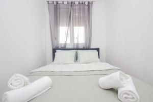 Postel nebo postele na pokoji v ubytování Apartman Tesla Zadar