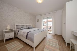 Postel nebo postele na pokoji v ubytování Apartmani Marica Beg