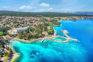 an aerial view of a small island in the water at Apartments Bella Vita 1 in Malinska