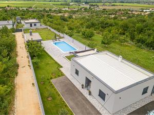 an aerial view of a house with a swimming pool at Villa Vukas in Mostar