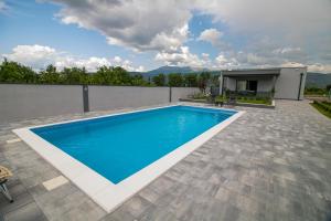 a swimming pool on top of a house at Villa Vukas in Mostar