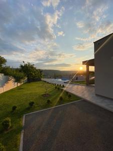 a rendering of a house with a view of the water at Villa Vukas in Mostar