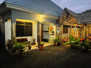 a house with plants in front of it at Safari villa in Arusha