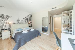A bed or beds in a room at Eleonore Elegant Rooms