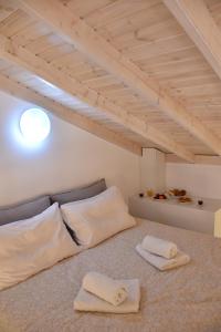 a room with two white pillows on the floor at The art studio in Samothraki