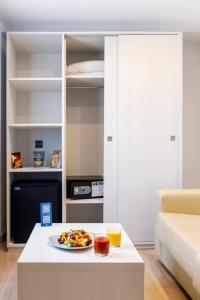 a plate of fruit on a table in a room at Mar Hotels Alcanada in Port d'Alcudia