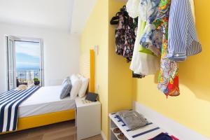 Postel nebo postele na pokoji v ubytování YourHome - Relais Loggia Li Galli