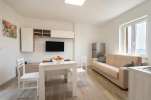 a living room with a couch and a table at Suite N12 - Luxury Apartment in Bari