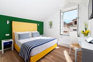 Postel nebo postele na pokoji v ubytování YourHome - Relais Loggia Li Galli