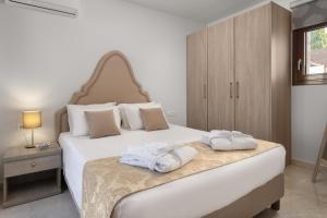 Postel nebo postele na pokoji v ubytování Sperveri Enalio Villas