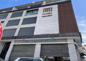 a building with a car parked in front of it at Maarif appartement moderne in Casablanca