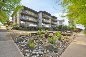 a building with a rock garden in front of it at Ocean View, 2 Baths, 2 Bedrooms, No Stairs, Best Area, WD, Jacuzzi Bath, Balcony, View, 925sf in Tacoma