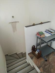 a room with a desk and a basketball hoop on the wall at Milina's Cozy Riverside Apartments in Milina