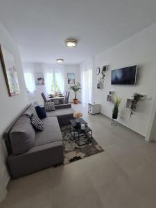 a living room with a couch and a table at Apartment Alea in Senj