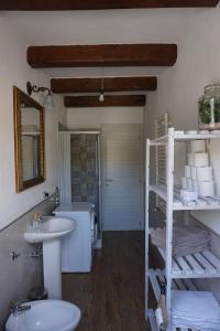 a bathroom with a sink and a toilet at Casa Selvaggia in Badolato