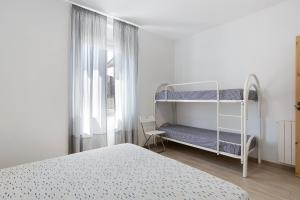 Posteľ alebo postele v izbe v ubytovaní Appartamento 4