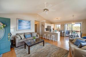 a living room with a couch and a table at Fire Pit and Views Falconcrest Cottage in Payson! in Payson