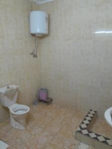 a bathroom with a toilet and a sink at منزل ابو يوسف القضاه in Ajloun