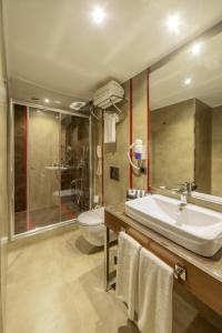 a bathroom with a sink and a toilet at Lamec Hotel Business in Gebze