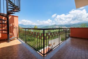 a balcony with a view of the mountains at Casa Stella vista Eolie in San Pier Niceto