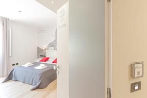 A bed or beds in a room at Eleonore Elegant Rooms