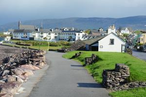 a winding road in a small town with houses at Butler Arms Hotel in Waterville