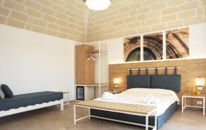 Postel nebo postele na pokoji v ubytování Gli Archi garden rooms