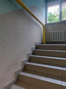 an empty staircase in a building with a window at Mieszkanie do wynajęcia w Centrum in Olecko