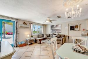 a living room with a couch and a table at Ocean View Villa in Holmes Beach