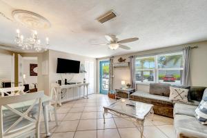 a living room with a couch and a table at Ocean View Villa in Holmes Beach