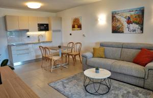 a living room with a couch and a table at Apartments Bagar in Portorož
