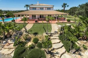 an aerial view of a house with a swimming pool at VILLA MONTE PARDAL w/ Heated Pool in Natural Park in Moncarapacho