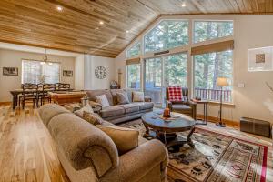 a living room with a couch and a table at Tahoe Discovery in South Lake Tahoe