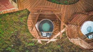 an overhead view of a pool on a wooden deck at Hotel Vivo Montaña in Pinto