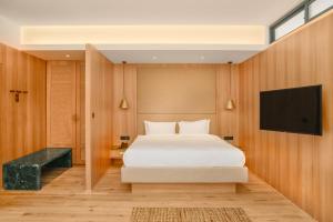 Voodi või voodid majutusasutuse Nomad Hotel Lazimpat toas