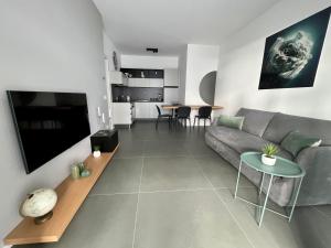 a living room with a couch and a table at SeaCity Vibes Apartments in Monopoli