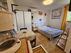 Postel nebo postele na pokoji v ubytování Apartments Ivan