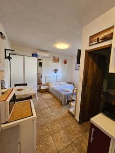 Postel nebo postele na pokoji v ubytování Apartments Ivan