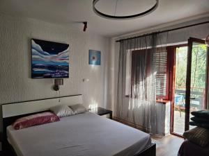 Postel nebo postele na pokoji v ubytování Apartments Ivan
