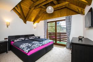 Postel nebo postele na pokoji v ubytování Apartmány Slunce