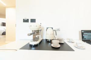 A kitchen or kitchenette at Eleonore Elegant Rooms