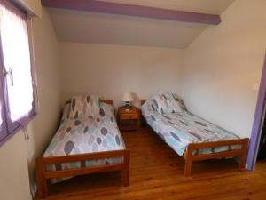 Ένα ή περισσότερα κρεβάτια σε δωμάτιο στο Gite arriou du bruca